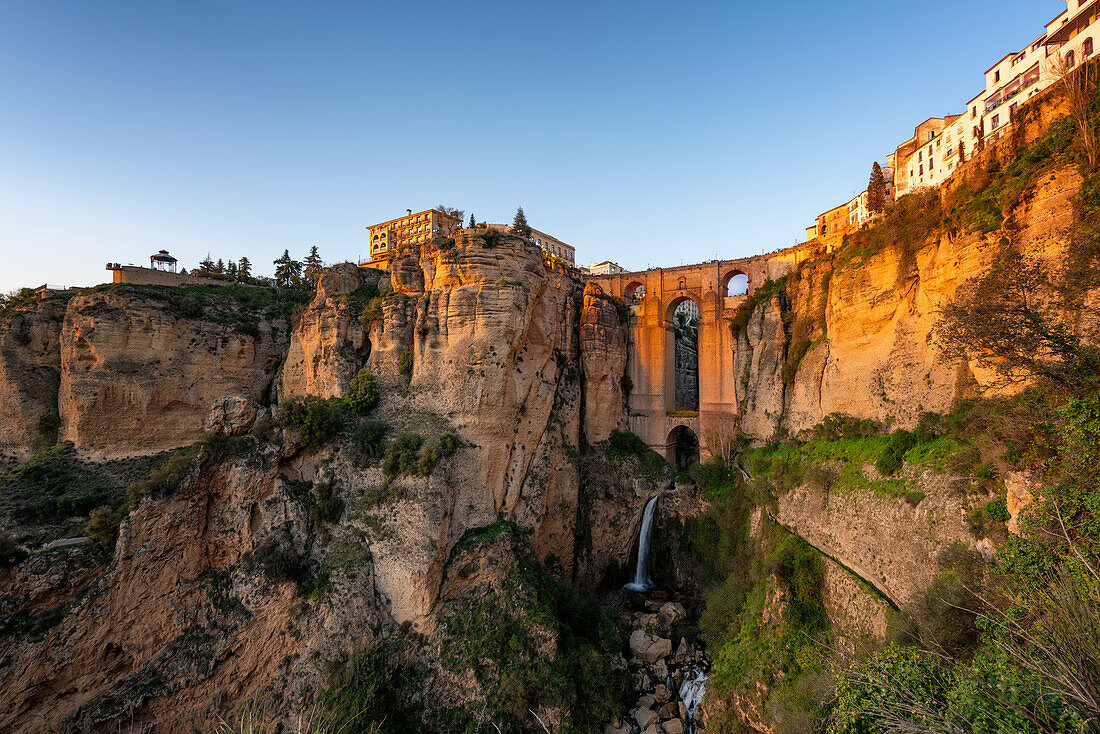 View with beautiful bridge and waterfall and traditional white village,Ronda,Pueblos Blancos,Andalusia,Spain,Europe