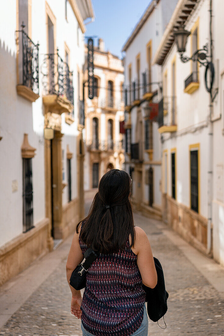 Woman in street of historic white village,Ronda,Pueblos Blancos,Andalusia,Spain,Europe