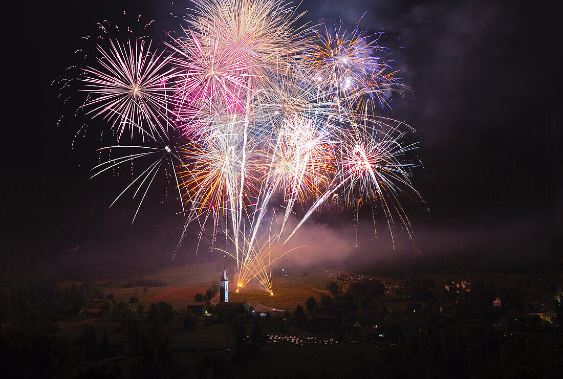 Magnificent fireworks over a small countryside church in Val d'Aiano,Emilia Romagna,Italy,Europe