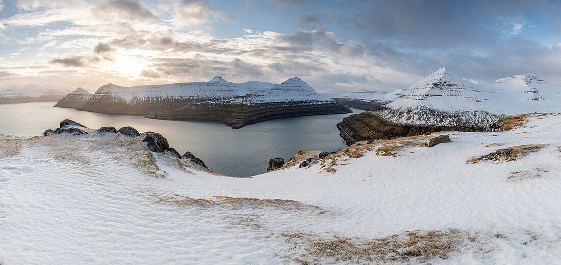 Snow-covered cliffs and mountains along Funningur fjord,Eysturoy Island,Faroe Islands,Denmark,Europe