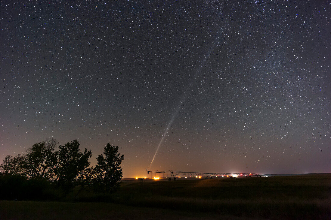 This is the odd sight of an arc of light across the sky created by the high-altitude fuel dump from an orbiting rocket. It looks like a huge comet or an odd auroral arc.