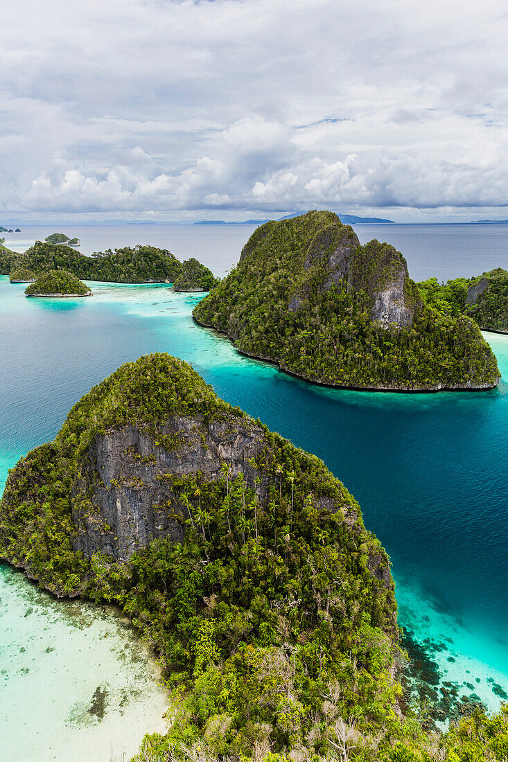 A view from on top of the small islets of the natural protected harbor in Wayag Bay,Raja Ampat,Indonesia,Southeast Asia,Asia