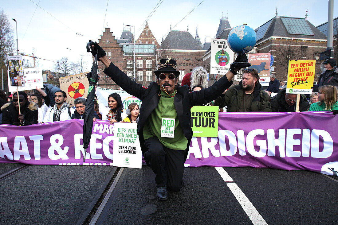 Environmental activists and supporters attend the March For Climate And Justice on November 12,2023 in Amsterdam,Netherlands. Protestors demand action from the Dutch government and world leaders to combat the climate change crisis,heat records are being broken again and again,resulting in profound changes for all life on Earth. An estimated 70,000 people have walked on Sunday with the climate march in Amsterdam,according to the Amsterdam municipality.