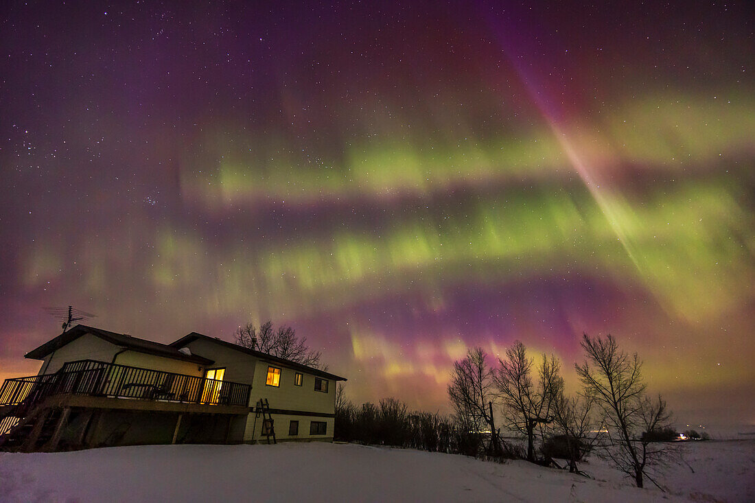 Auroral streamers or rays rather than classic curtains as part of the pulsating phase of the great equinox display of Northern Lights on March 23,2023. The rays have a strong vertical structure from precipitating electrons but were pulsing off and on rather than rippling. While the predominent colour is green,there is a lot of red and magenta mixed in. The rays are converging upward to the magnetic zenith. This is looking northwest over my house. A short exposure froze the motion and pulsations to better record the structure. Cassiopeia is at centre. The Pleiades are at left.