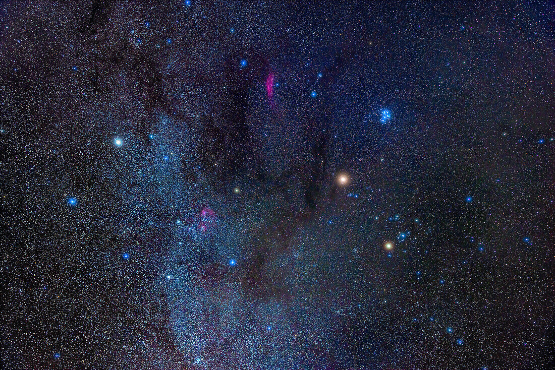 Mars,the bright orange object right of centre,is here amid the stars and constellations of the winter Milky Way in January 2023. Mars is in Taurus,above Aldebaran and the Hyades,and below the blue Pleiades. The stars of Auriga are at left. At top are stars in Perseus,including the reddish California Nebula. The interstellar Dark Clouds of Taurus are at centre.