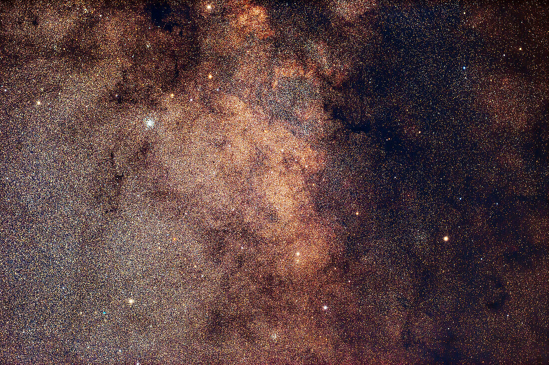 This is a framing of the Scutum Starcloud in the Milky Way,with the bright and rich Wild Duck Cluster,aka Messier 11,embedded in the Starcloud at upper left. The smaller open star cluster M26 is at bottom centre; while the globular cluster NGC 6712 is at lower left,with the small green planetary nebula IC 1295 visible beside it to the left. The area is a study in contrasts between the rich starclouds of the Milky Way and the dark lanes of interstellar dust. The most prominent and densest of those is at upper right,Barnard 103. At top is B110. The general regime of interstellar dust in the regi