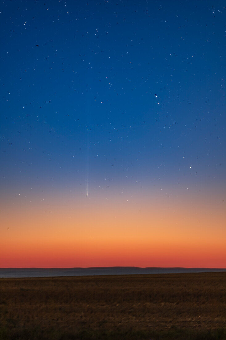 Comet Nishimura (C/2023 P1) captured about 25 minutes after rising in the pre-dawn sky on September 10,2023 with the sky bright with morning twilight colours. The comet was only about 4º above the horizon at this time. This was about 5:25 am MDT.