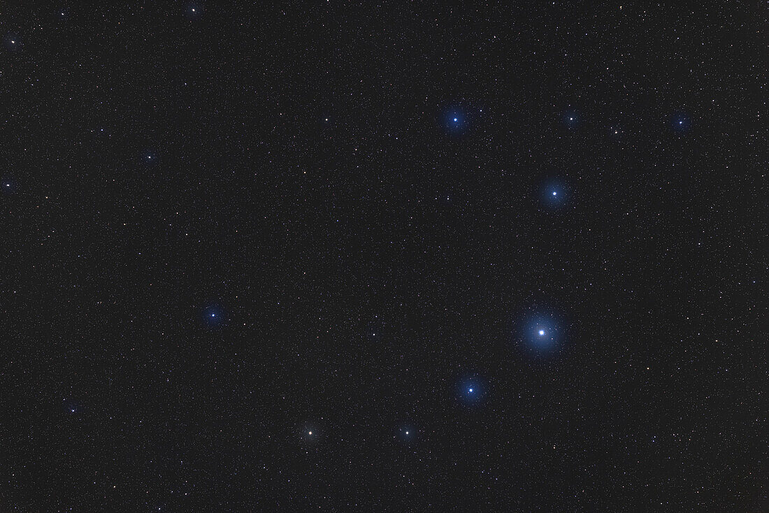 A porttait of the constellation of Corona Borealis,the Northern Crown,in the northern spring sky. The brightest star is Alphecca. The frame contains the yellow supergiant and variable star R Coronae Borealis,aka Variabilis Coronae,below centre.