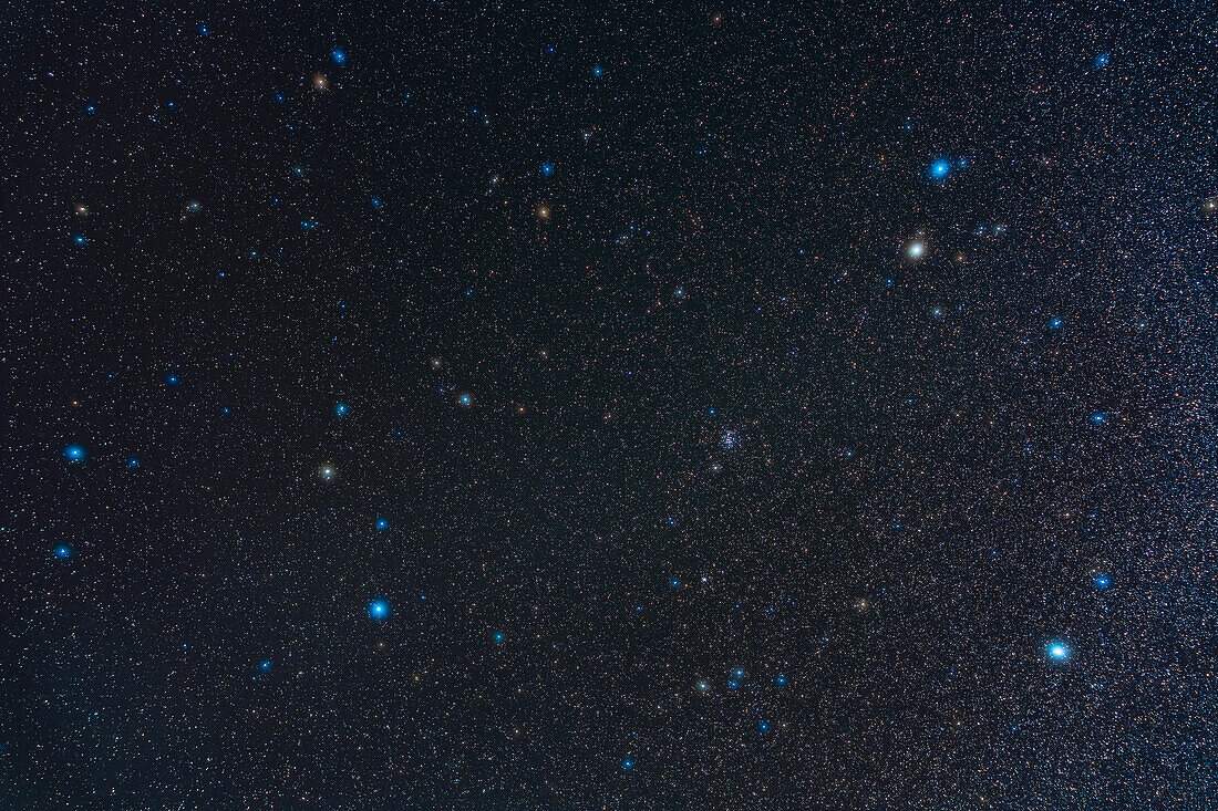 A framing of the northern spring constellation of Cancer the Crab,between the constellations of Leo (at left with the bright star Regulus) and part of Gemini (at upper right with Castor and Pollux) and Canis Minor (at lower right woth Procyon). Cancer is marked by the large binocular star cluster,Messier 44,the Beehive,at centre here. The head of Hydra is at bottom centre. Between the two is the small star cluster M67,just resolved here.