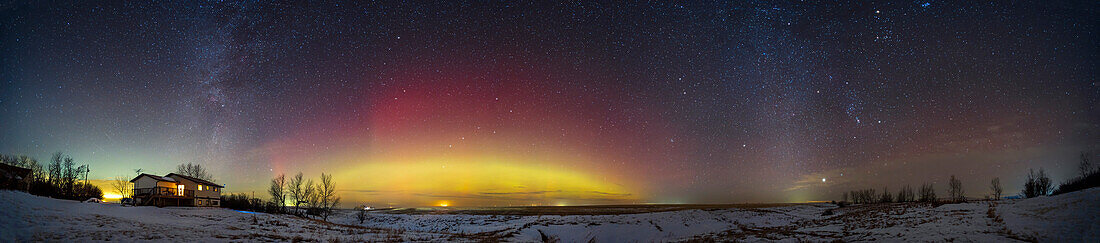 This is a 270° panorama of the auroral arc seen across the northern sky on January 14,2023. It is framed between the setting summer Milky Way (at left in the northwest) and the rising winter Milky Way (at right in the southeast).