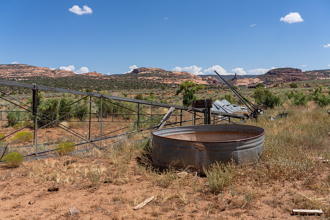 An old watering tank and a collapsed windpump or windmill on a former cattle ranch in southeastern Utah.