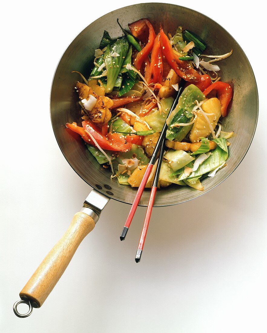Wok with cabbage, pineapple, pepper ,sprouts, sesame