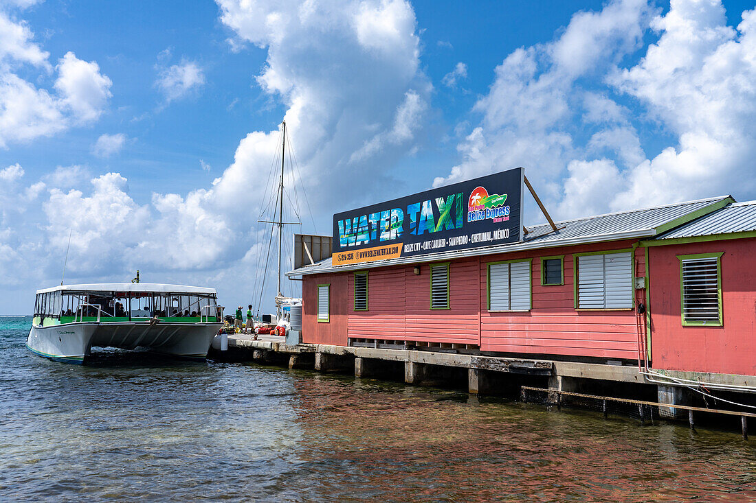 A Belize water taxi passenger ferry docked at the terminal in San Pedro on Ambergris Caye,Belize.