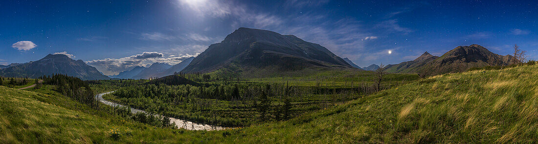 The Blakiston Valley in Waterton Lakes National Park,in Alberta,Canada,in a panorama captured by moonlight,May 29,2023. Illumination is from the waxing gibbous Moon just off frame at top.