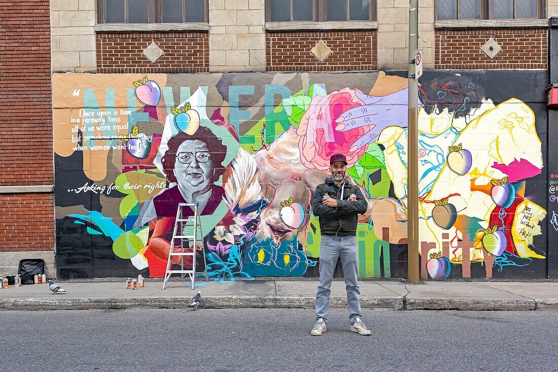 Canada, Quebec province, Montreal, the artist Ankhone, graphic designer, illustrator, painter and member of the ASHOP collective in front of one of his works, collaborative mural aimed at women and to open up mentalities as part of Under Pressure International Graffiti Convention