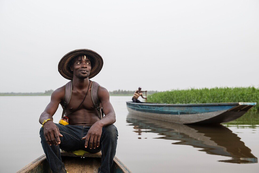 Ivory Coast, Grand Bassam, dugout drivers on the lagoon