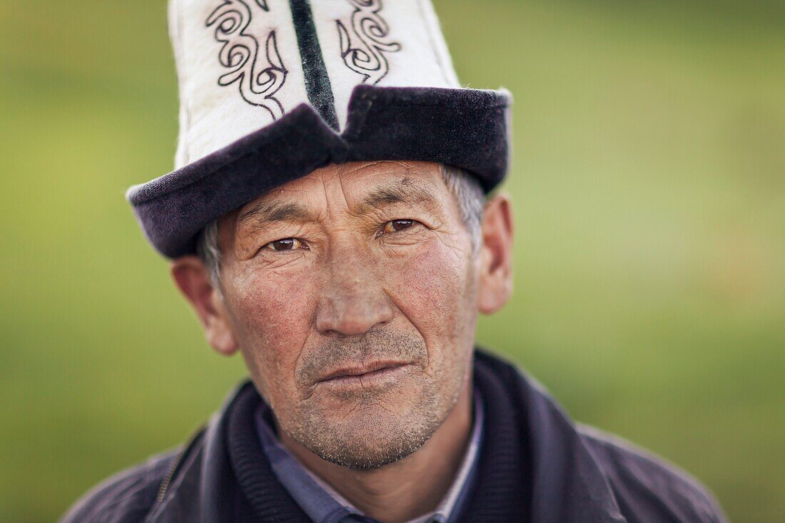 Kyrgyzstan, Naryn Province, Son-Kol Lake, altitude 3000m, portrait of a man wearing the traditional Kyrgyz hat Ak-Kalpak