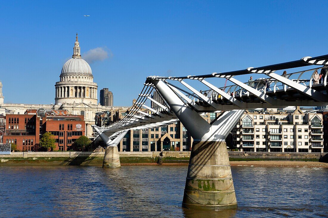 United Kingdom, London, the City, the Millennium Bridge by architect Norman Foster on the Thames river and St. Paul's Cathedral in the background