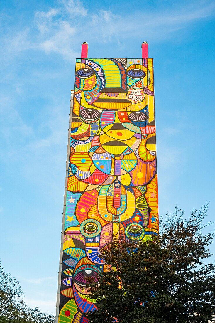 France, Paris, street art, fresco of a totem of the artist Da Cruz on the facade of a building 9 rue Perichaux