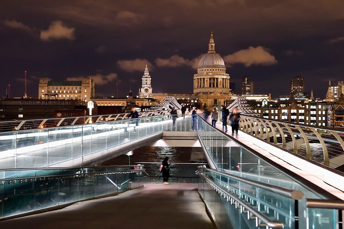 United Kingdom, London, the Millennium Bridge by architect Norman Foster on the Thames river and St. Paul's Cathedral in the background