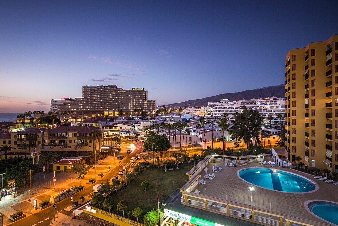 Spain, Canary Islands, Tenerife Island, Playa de Las Americas, resort area, dusk