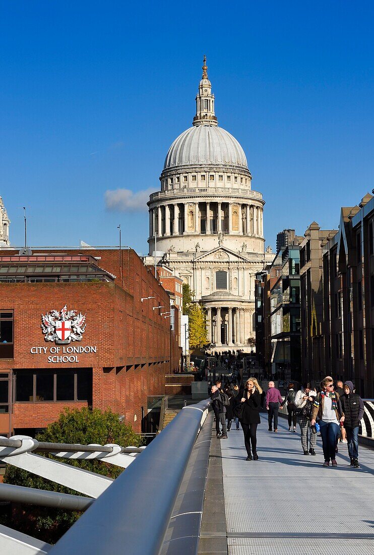 United Kingdom, London, The City, St. Paul's Cathedral seen from the Millennium Bridge by architect Norman Foster on the Thames river, the City of London School