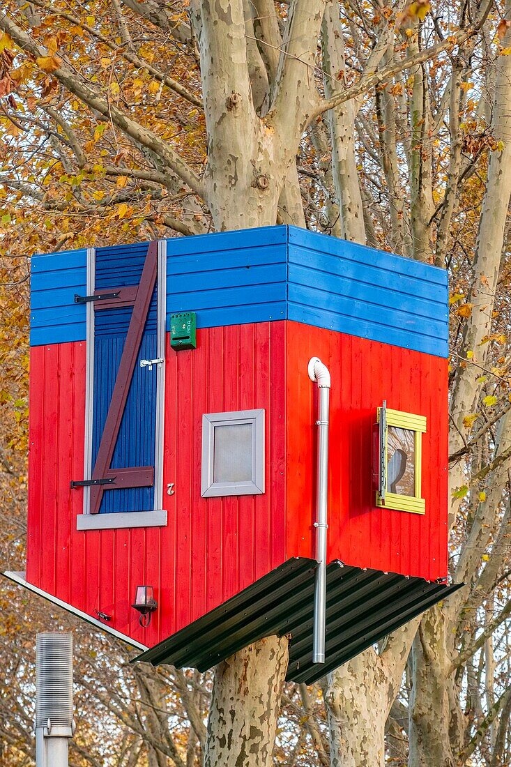 France, Paris, Parc de la Villette in autumn, house reversed in the trees