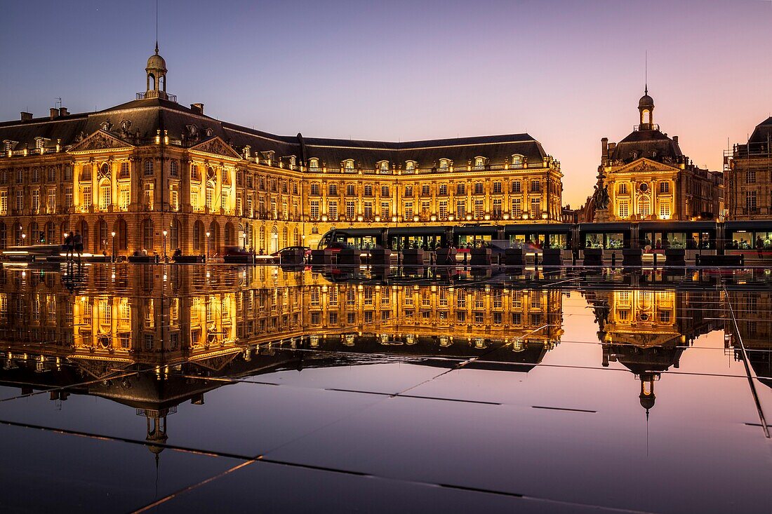 France, Gironde, Bordeaux, area classified as World Heritage by UNESCO, Saint-Pierre district, tram on the Place de la Bourse, the reflecting pool dating from 2006 and made by the fountain maker Jean-Max Llorca