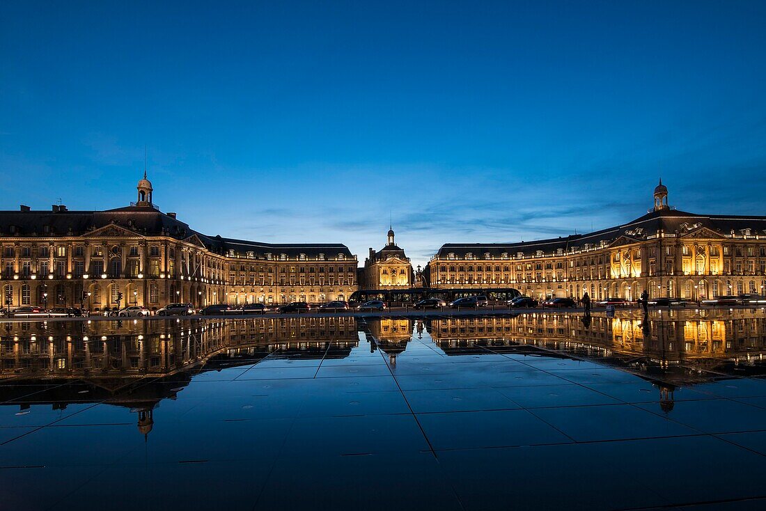 France, Gironde, Bordeaux, the Place de la Bourse at dusk and its reflection in the largest water mirror in the world with 3450 m²