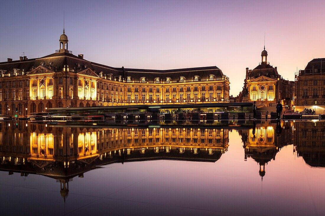 France, Gironde, Bordeaux, area classified as World Heritage by UNESCO, Saint-Pierre district, tram on the Place de la Bourse, the reflecting pool dating from 2006 and made by the fountain maker Jean-Max Llorca