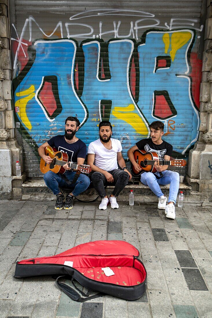 Turkey, Istanbul, Beyoglu area, students playing in the street