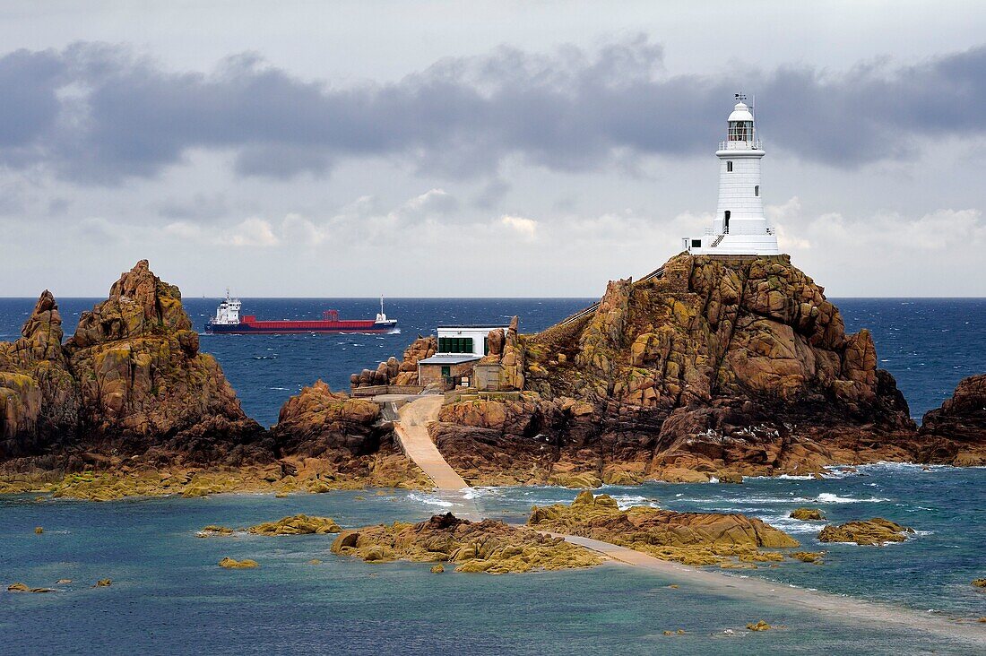 United Kingdom, Channel Islands, Jersey, La Corbière lighthouse at rising tide