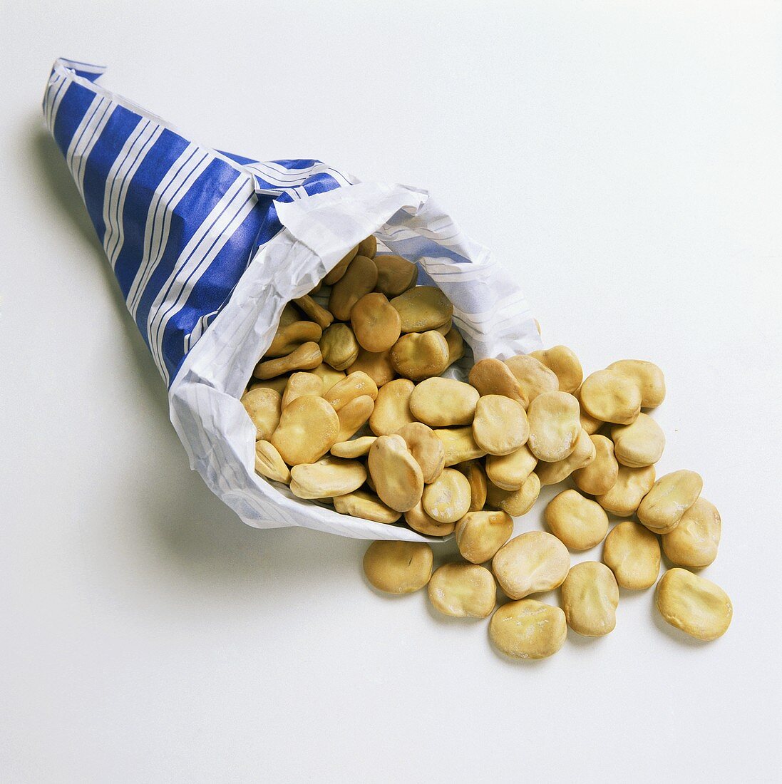 Broad beans falling out of paper bag