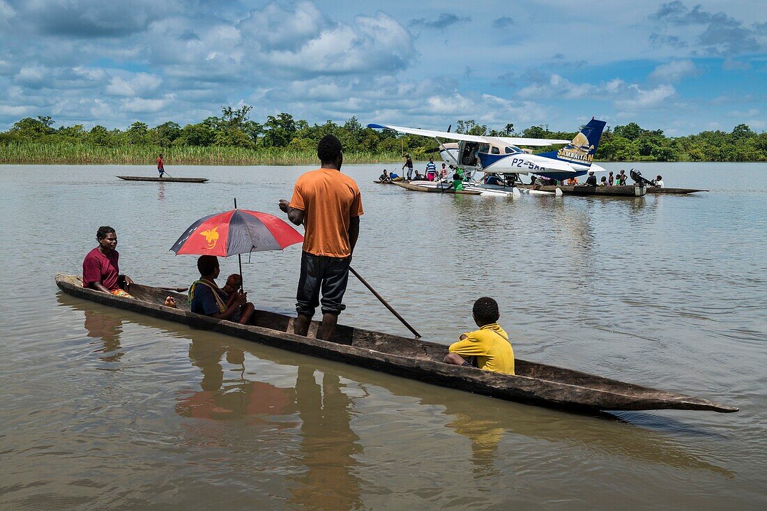 Papua New Guinea, East Sepik Province, Sepik River Region, Luke Hammer of the Samaritan Aviation Missionary Company and Dr. Preston Karue deliver Polio Vaccines by Seaplane in the Sepik River Area during the Eradication Campaign of the outbreak in 2019