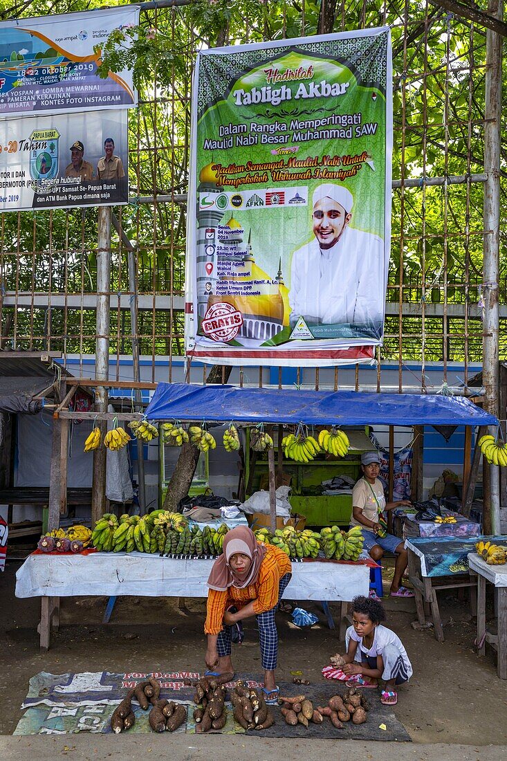 Indonesia, Papua, Raja Ampat, Waisai, islamic poster on the market