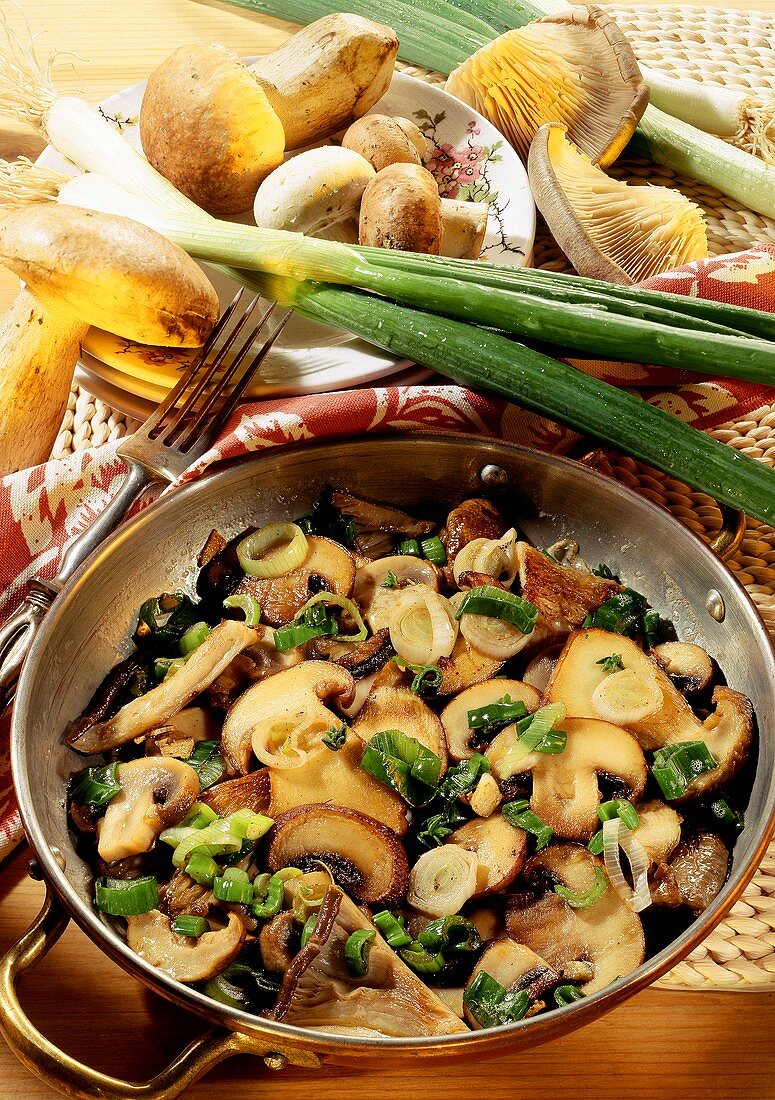 Mixed forest mushroom stir-fry with spring onions