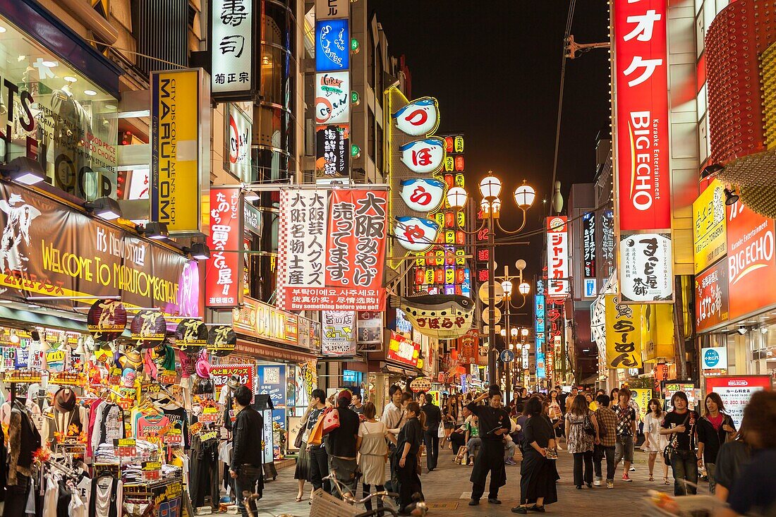 Japan, Honshu Island, Kansai Region, Osaka, Namba district, Dotonbori street, crowd and street filled with illuminated advertising