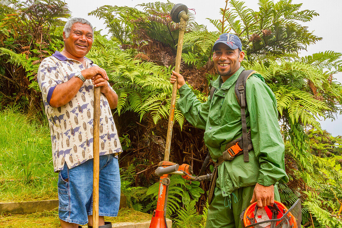 Portrait of two smiling men met on the trail of Diana's Peak National Park on Saint Helena, South Atlantic Ocean