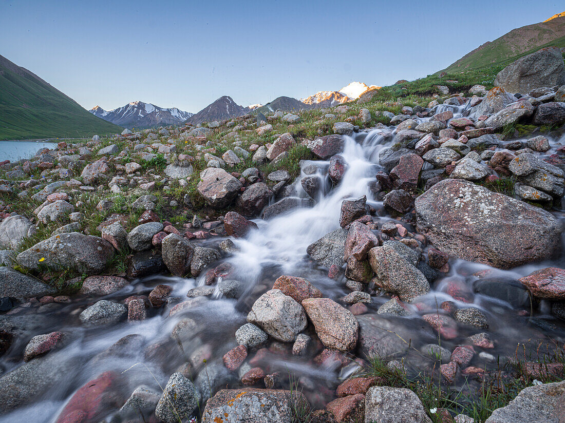 A stream flowing down towards Kol-Ukok lake in the mountains of Kyrgyzstan, Central Asia, Asia