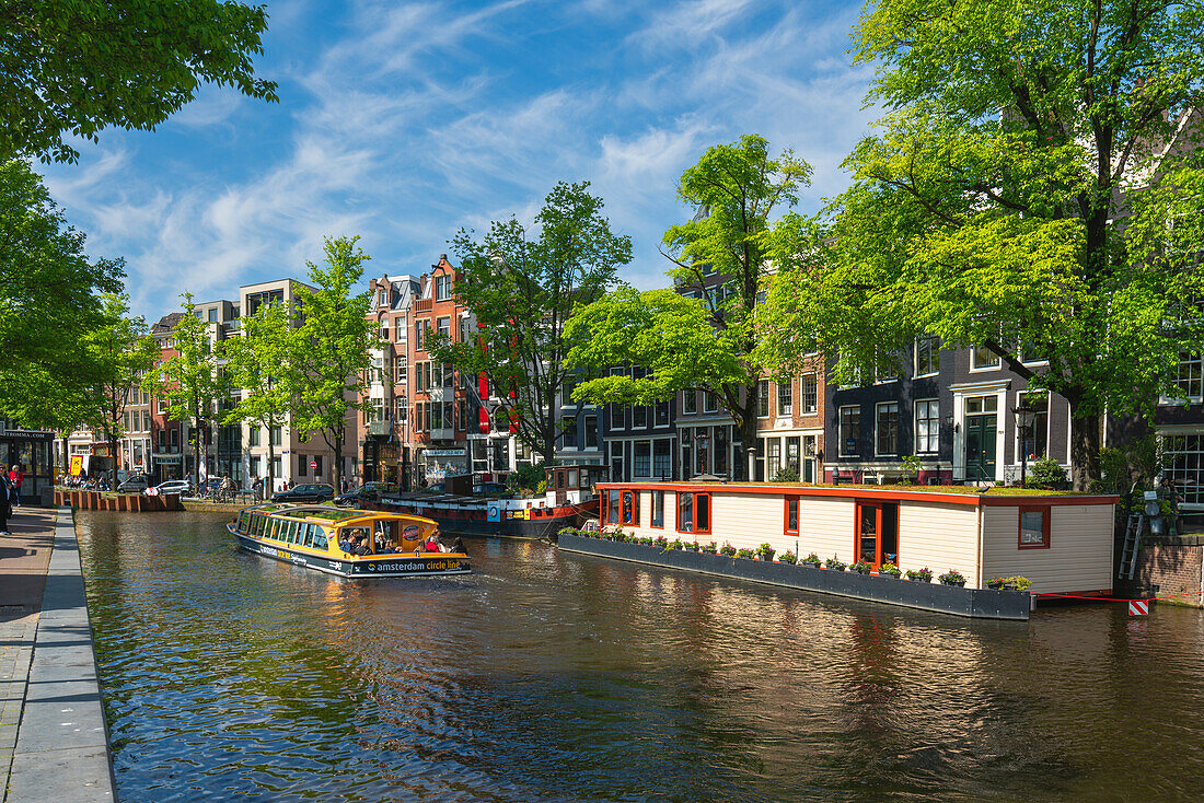 Tourist boat on Prinsengracht canal, Amsterdam, The Netherlands, Europe