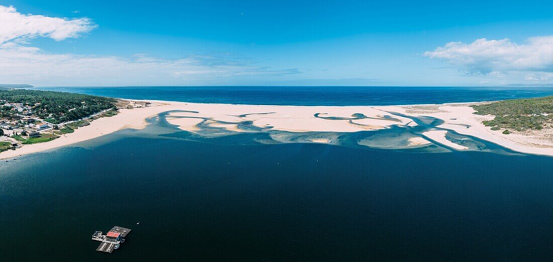 The Lagoa de Albufeira, a picturesque lagoon opening out on a beautiful beach, the Praia da Lagoa de Albufeira, Costa da Caparica coastline, Portugal, Europe