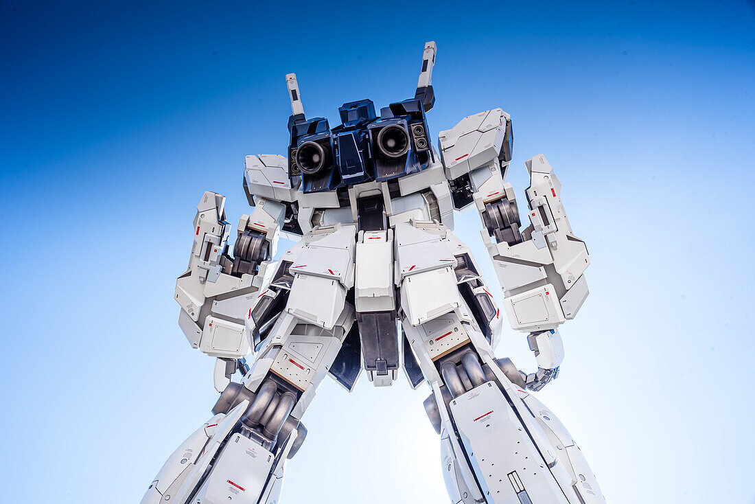 The life-sized Unicorn Gundam statue, Odaiba, against a blue sky, Tokyo, Honshu, Japan, Asia