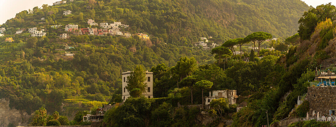 View of hills and villas near Aragonese Castle at sunset, Port of Ischia, Island of Ischia, Campania, Italy, Europe