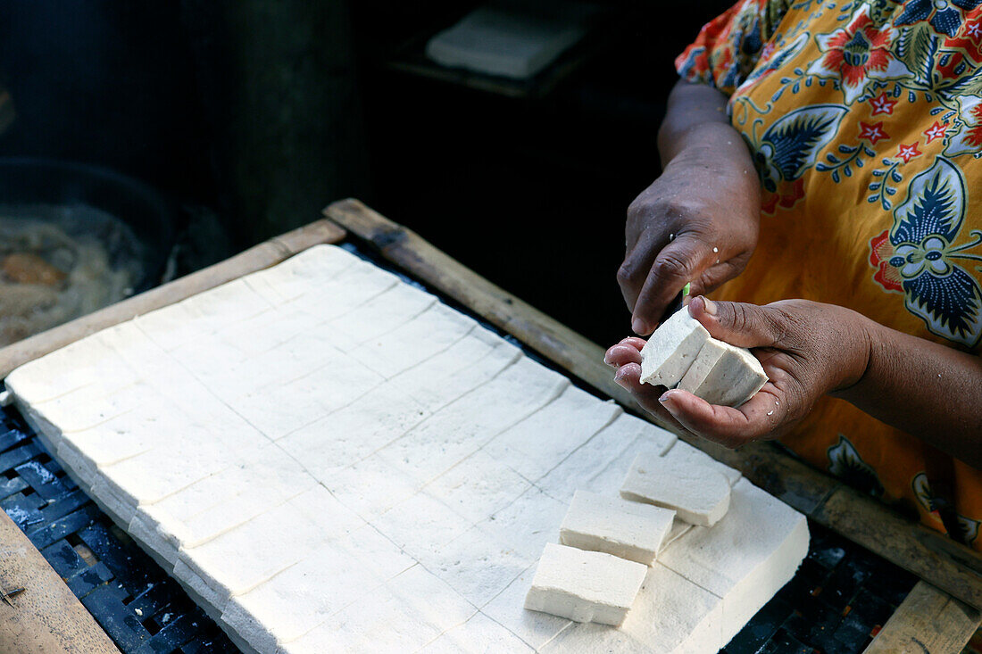 Worker making tofu, a food prepared by coagulating soy milk, in a traditional family factory, Yogyakarta, Java, Indonesia, Southeast Asia, Asia, Asia