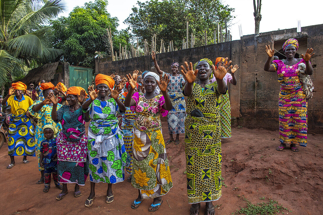 Women's group waving goodbye in Dokoue, Benin, West Africa, Africa