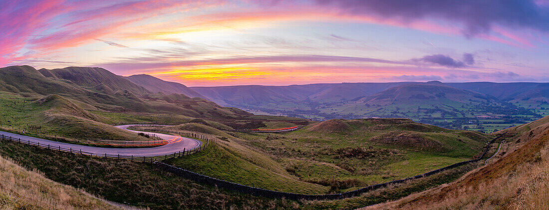 View of landscape and trail lights in the Hope Valley at sunset, Peak District National Park, Baslow, Derbyshire, England, United Kingdom, Europe