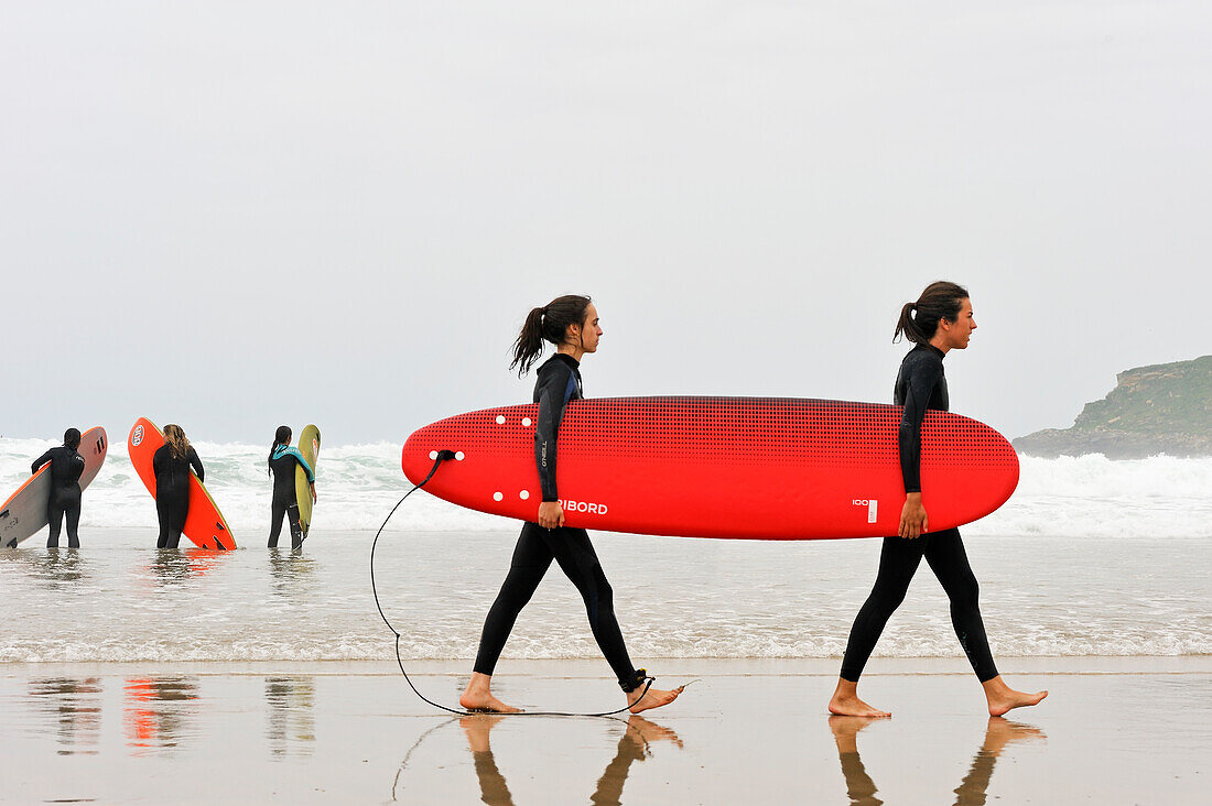 Surf class on Zurriola beach, district of Gros, San Sebastian, Bay of Biscay, province of Gipuzkoa, Basque Country, Spain, Europe