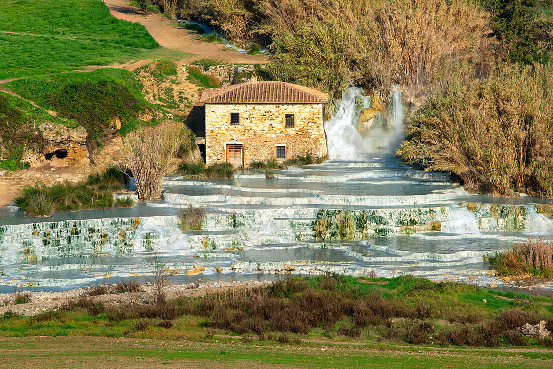 Saturnia hot springs with turquoise water and an old mill, Saturnia, Tuscany, Italy, Europe