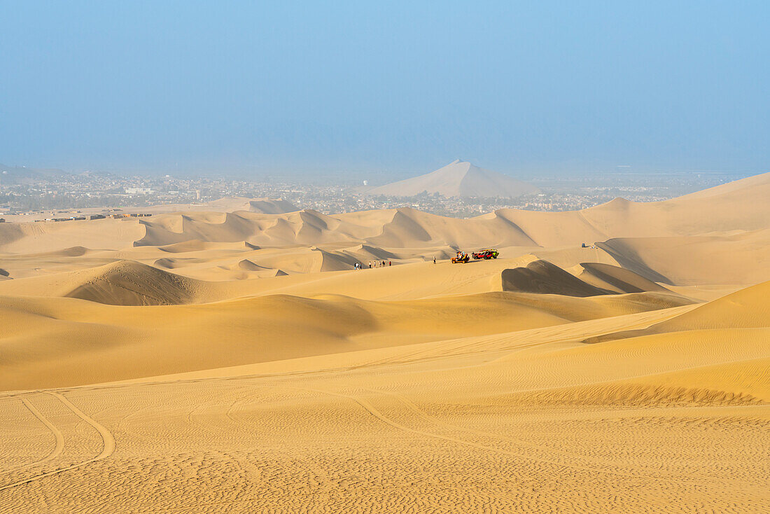 Dune buggies on sand dunes in desert, Huacachina, Ica District, Ica Province, Ica Region, Peru, South America