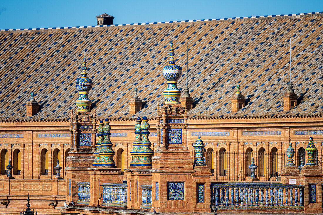 Close up view of the ornate architectural features of Plaza de Espana in Seville, Spain, showcasing historic design and intricate details. A stunning example of Spanish architecture.